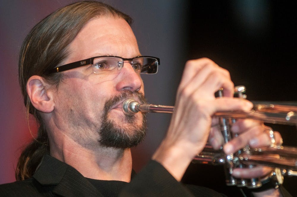 Andy Wilson of Those Delta Rhythm Kings plays the trumpet Friday night, Sept. 21, 2012 during the annual BluesFest in Old Town, Lansing. The festival brings live blues musicians to the streets of Lansing for thousands of fans to enjoy. Adam Toolin/The State News