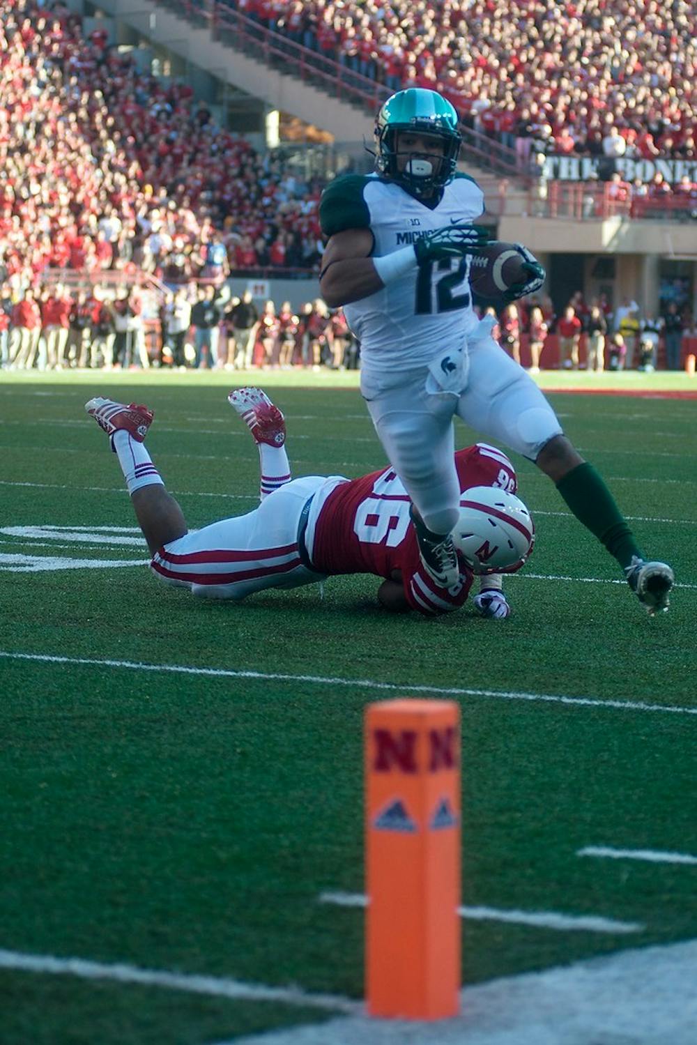 	<p>Freshman running back R.J. Shelton runs for a touchdown Nov. 16, 2013, at Memorial Stadium in Lincoln, Neb. The Spartans lead against the Cornhuskers at the half, 20-7. Julia Nagy/The State News </p>