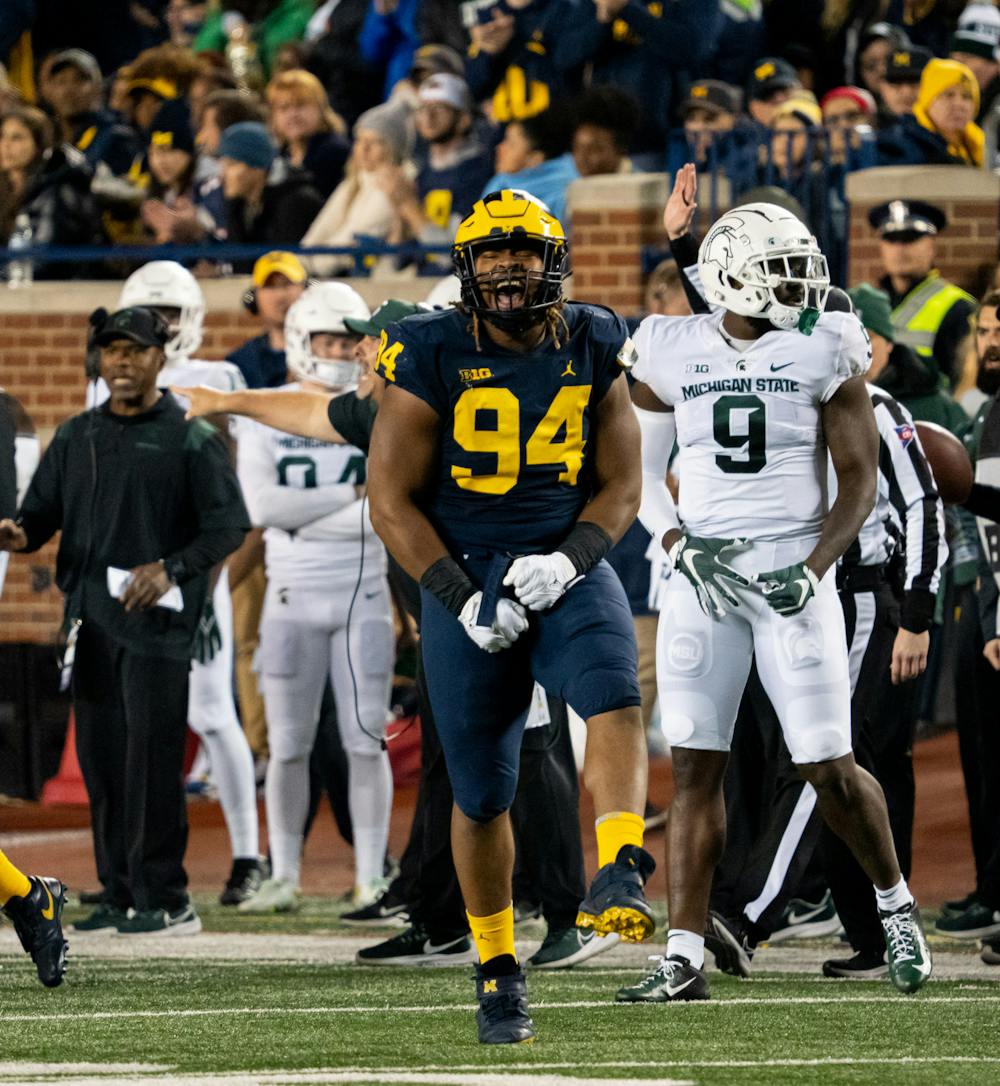 <p>Michigan defensive lineman Kris Jenkins (94) celebrates after a play during the Spartans' loss to the Wolverines on Oct. 29, 2022.</p>