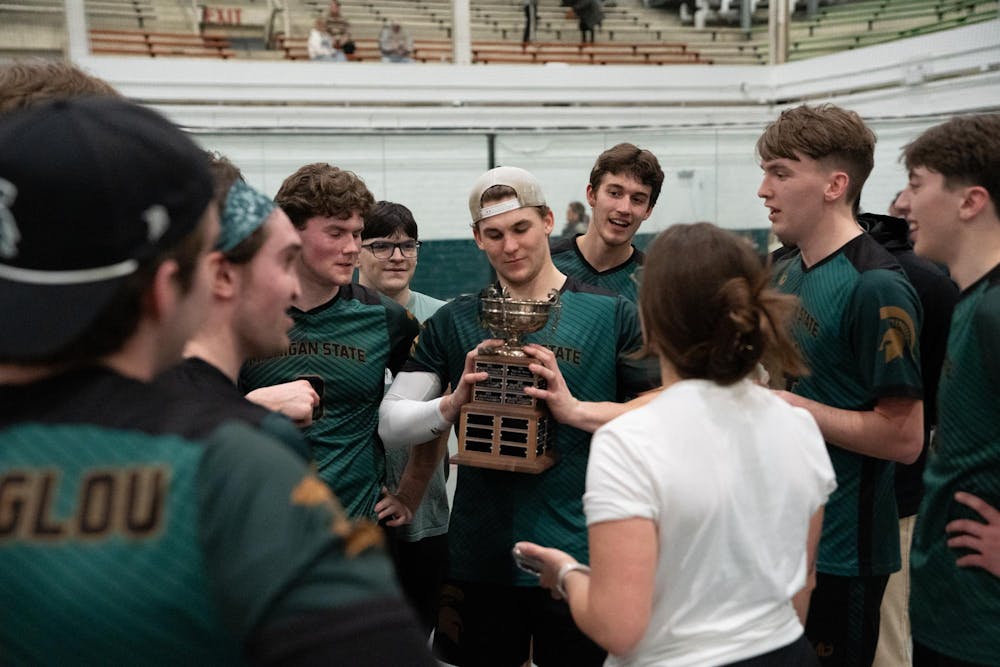 Michigan State University’s club dodgeball team holds the trophy after defeating Grand Valley University at the 2026 Michigan Dodgeball Cup at Demonstration Hall on Feb. 21, 2026.