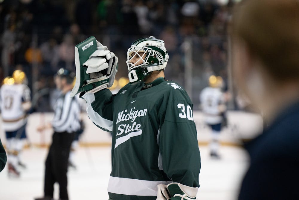 MSU alternate goalie Jon Mor raises his glove hand in celebration at the conclusion of MSU’s victory over Notre Dame. The Spartans will play the Fighting Irish again on Sunday, March 5, 2023.