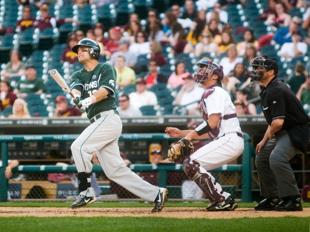 Senior shortstop Justin Scanlon looks for the ball after making a hit on Tuesday evening when Michigan State faced Central Michigan at Comerica Park in Detroit. The Spartans beat the Chippewas 5-2. Samantha Radecki/The State News