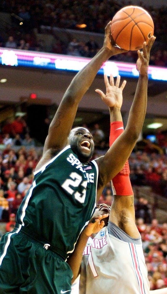 Senior forward Draymond Green goes up to score a two-point field goal despite Ohio State forward Deshaun Thomas's attempt to stop the play. Green scored 12 points for the Spartans, and led by 9 rebounds.  The Spartans defeated the Ohio State Buckeyes, 58-48, Saturday night at Schottenstein Center at Columbus, Ohio. /The State News