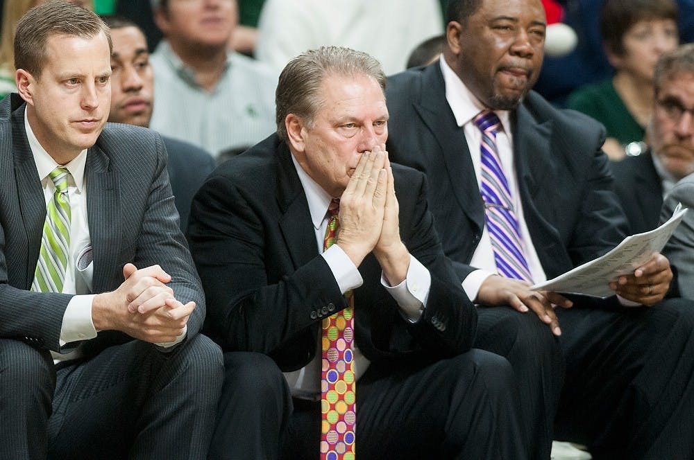 <p>Head Coach Tom Izzo looks out to his players with associate head coach Dwayne Stephens and assistant coach Dane Fife Dec. 20, 2014, during a Spartan free-throw at the end of the second half during the game against Texas Southern at Breslin Center. The Spartans were defeated by the Tigers, 71-64. Erin Hampton/The State News</p>