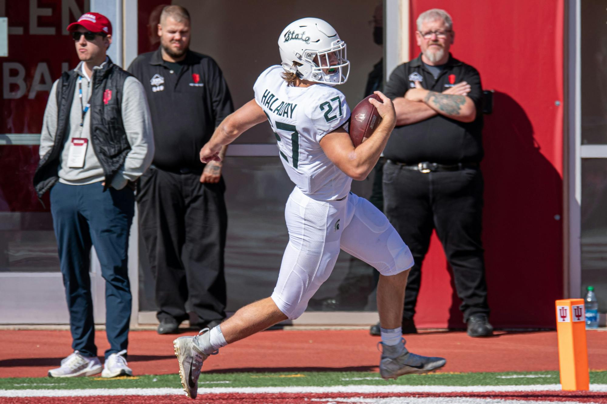 <p>Redshirt freshman Cal Haladay runs the ball into the end zone, completing a pick-six. The Spartans found a way to hold on against the Hoosiers with a 20-15 win, scraping to their first 7-0 start since 2015 on Oct. 16, 2021.</p>