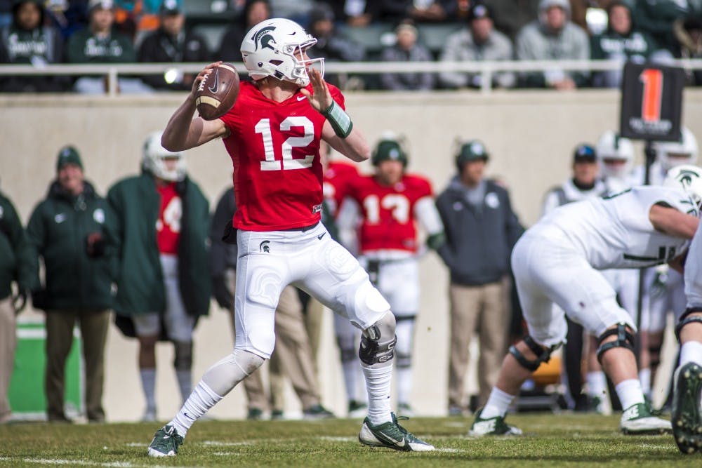 Sophomore quarterback Rocky Lombardi (12) goes to throw the ball during the annual Green and White spring game on April 7, 2018 at Spartan Stadium. At the half, White led Green, 14-9. (Nic Antaya | The State News)