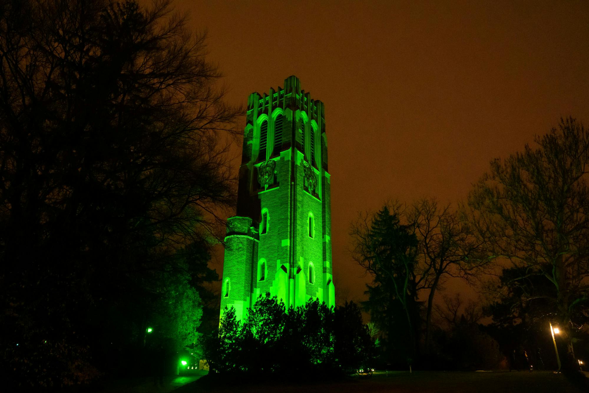 Beaumont Tower on Michigan State University campus lit up green on Feb. 27, 2023 to honor the victims of the mass shooting on Feb. 13, 2023.