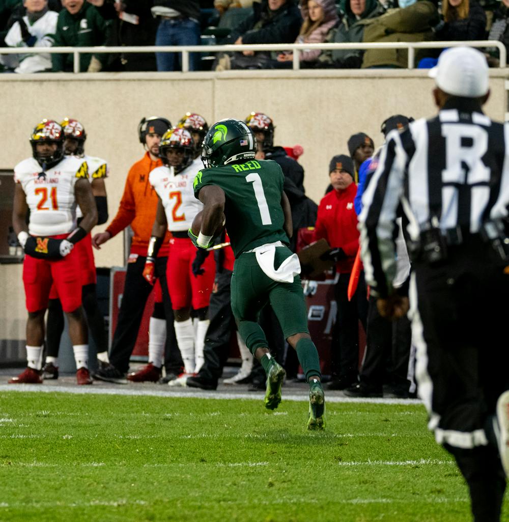 Michigan State wide reciever Jayden Reed (1) runs the ball towards the endzone during Michigan State's victory over University of Maryland on Nov. 13, 2021.