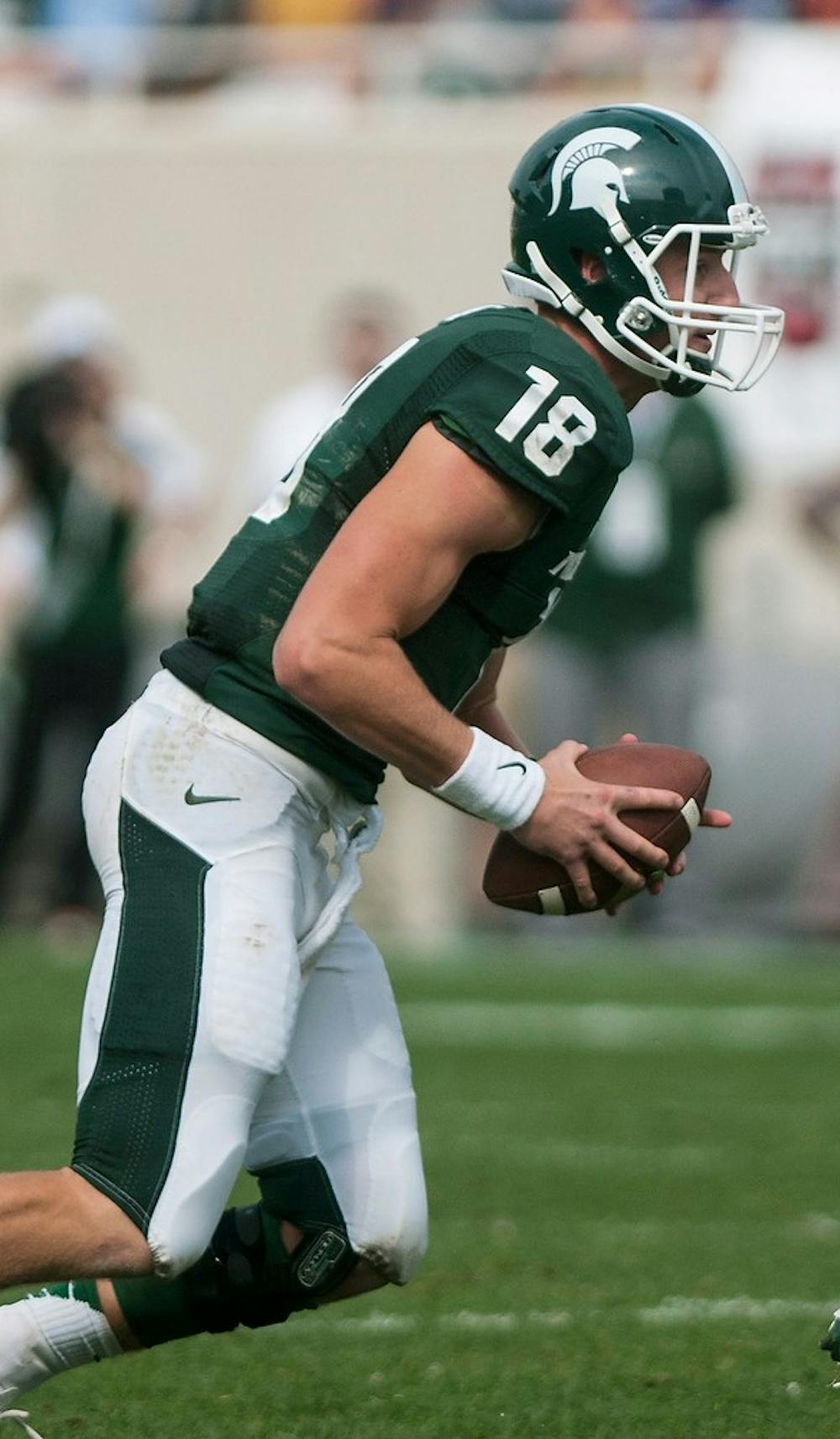 	<p>Sophomore quarterback Connor Cook, 18, looks for an open pass, Sept. 7, 2013, against South Florida at Spartan Stadium. The Spartans defeated the Bulls, 21-6. Margaux Forster/The State News </p>