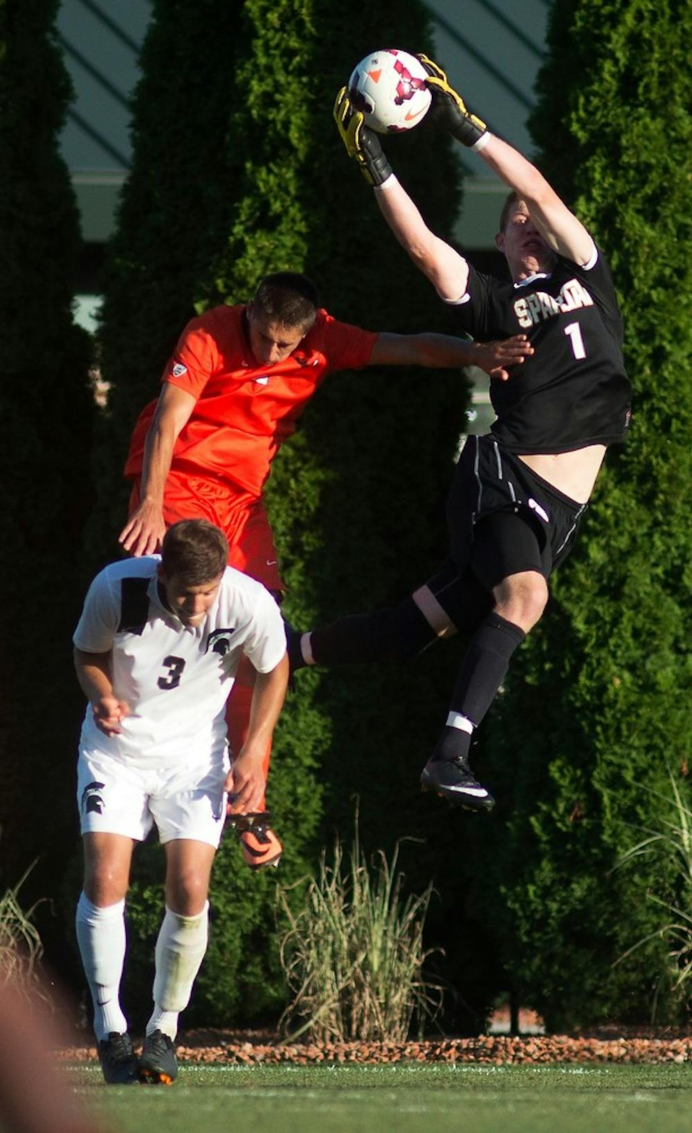 	<p>Sophomore goal keeper Zach Bennett catches the ball during the game against Oregon State on Sept. 6, 2013, at DeMartin Stadium at Old College Field. The Spartans won, 1-0. Julia Nagy/The State News </p>