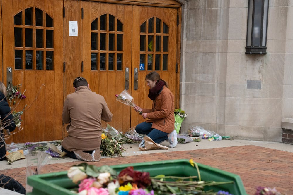 <p>MSU students, faculty and staff gather to help clean up the memorial sites at the Rock, Spartan Statue, the MSU Union and Berkey Hall on Mar. 2, 2023</p>