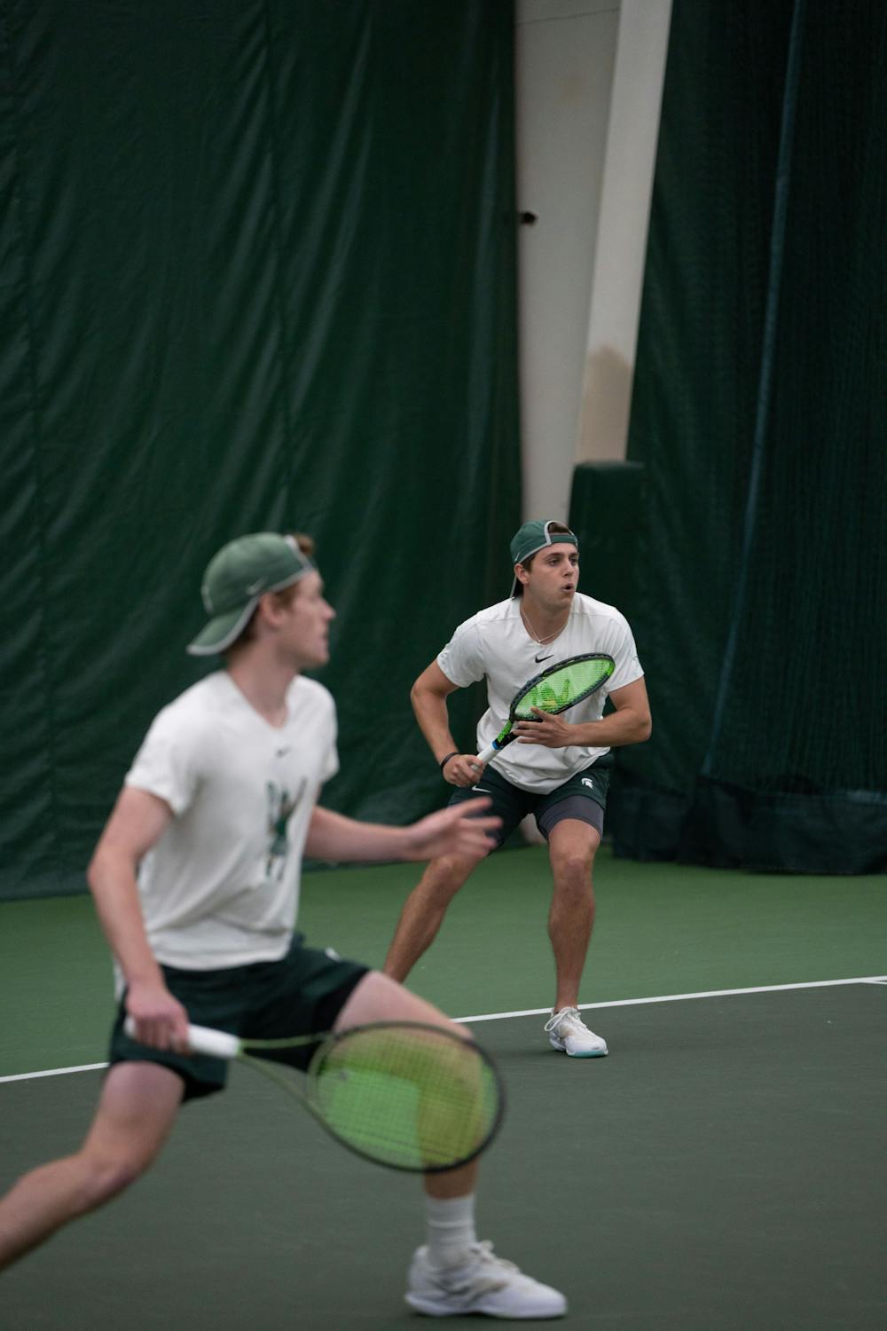 <p>Junior Graydon Lair gets ready to return the ball with his doubles partner sophomore Max Sheldon against Michigan at the MSU Tennis Center on March 30, 2023. The Spartans lost to the Wolverines 6-1.</p>