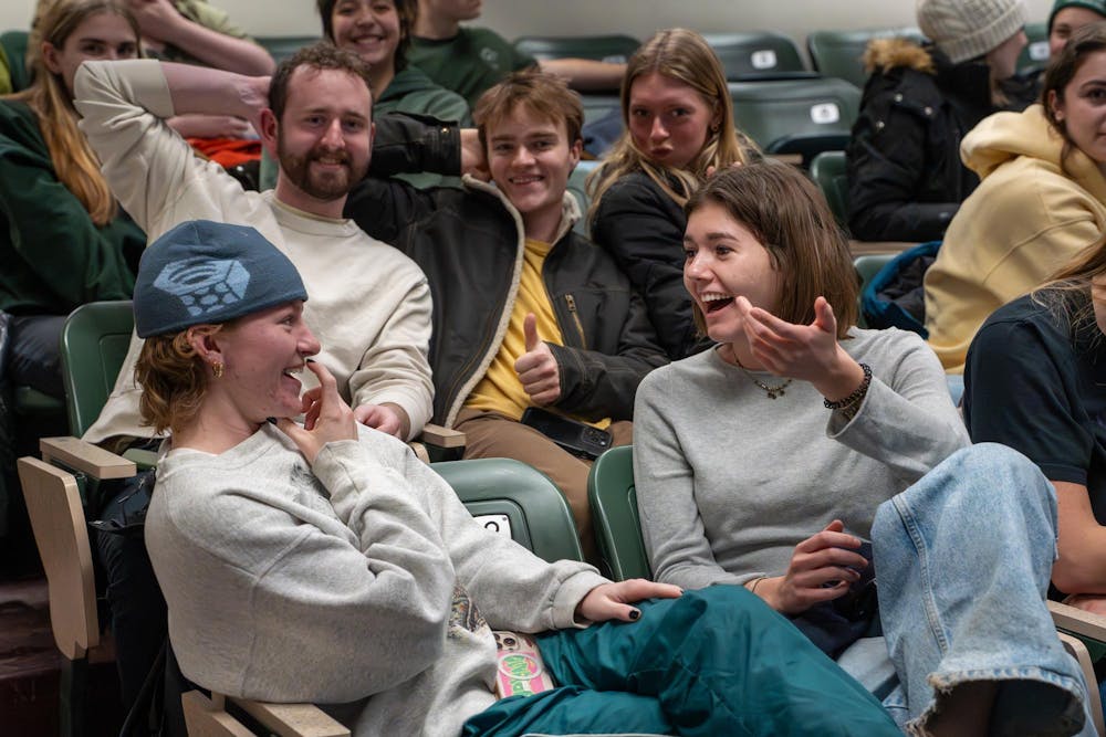 Outdoors Club members Isaac Rej, a junior majoring in environmental economics and food industry management; Blaine Mankvitz, a senior majoring in supply chain management; Izzy Smith, a senior majoring in environmental science and sustainability; Lilly Sarya, a junior majoring in international relations; and Vivian Gunn, a junior majoring in fish ecology and management, laugh together during a group discussion at an Outdoors Club meeting on Monday, Feb. 9, 2026, at IM West Recreational Facility in East Lansing, Mich.