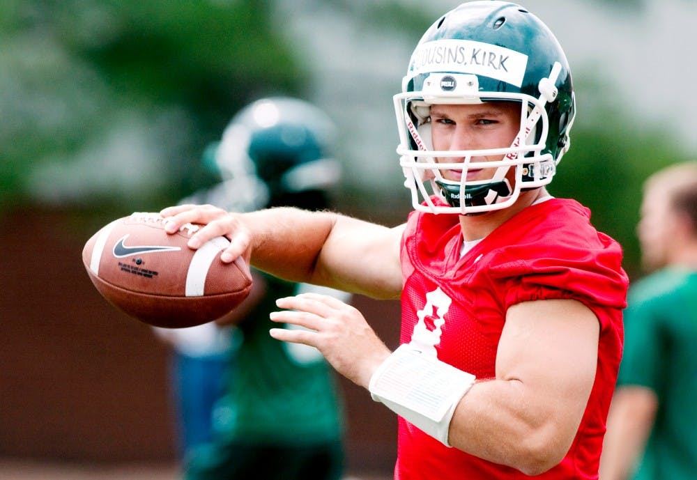 	<p>Senior quarterback Kirk Cousins prepares to throw a pass to in warmups Aug. 8 at the 2011 Spartan Football Media Day.</p>