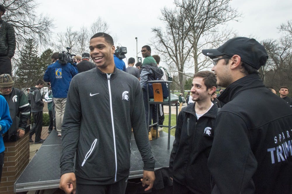 Freshman forward Miles Bridges (22) laughs as he speaks with fans after Bridges's announcement that he will be continuing his MSU basketball career in the 2017-2018 season on April 13, 2017 at The Spartan statue. Hundreds of students gathered around the statue in support of Miles Bridges's return to MSU.