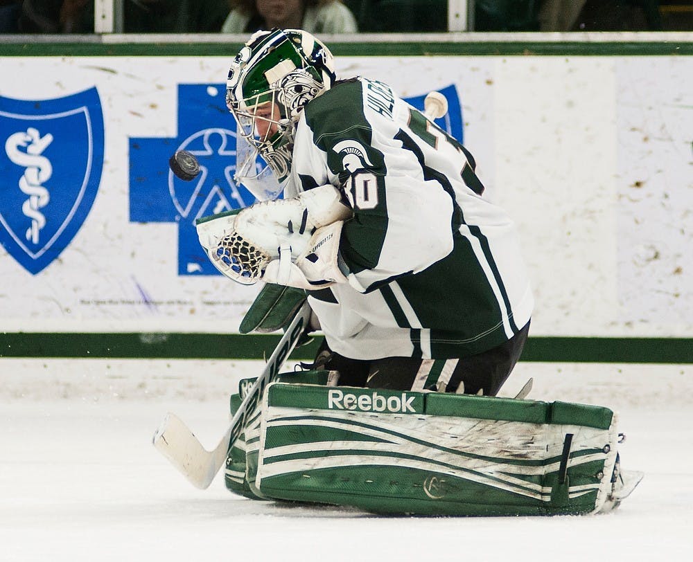 	<p>Sophomore goaltender Jake Hildebrand makes a save during the game against Penn State on Jan. 17, 2014, at Munn Ice Arena. The Spartans defeated the Nittany Lions, 3-0. Danyelle Morrow/The State News</p>