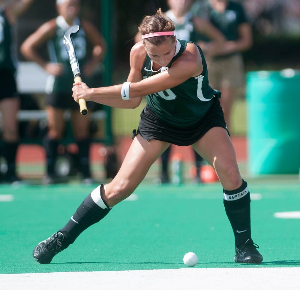 <p>Senior midfielder Becky Stiles passes the ball during the game against Maryland on Sept. 28, 2014, at Ralph Young Field. The Terrapins defeated the Spartans, 4-2. Jessalyn Tamez/The State News</p>