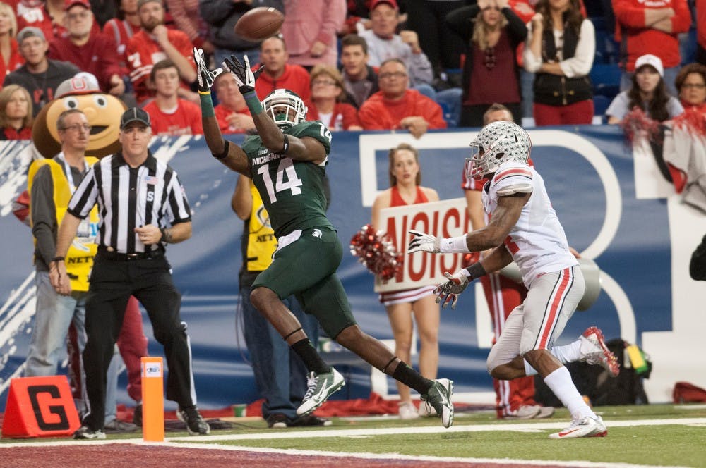 	<p>Junior wide receiver Tony Lippett catches the ball for a touchdown Dec. 7, 2013, at Lucas Oil Stadium in Indianapolis during the Big Ten Championships. The Spartans lead 17-10 at the half. Julia Nagy/The State News</p>