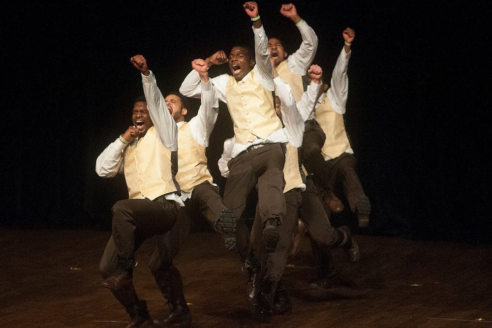 <p>Members of Iota Phi Theta Fraternity, Inc. perform Feb. 28, 2015, during the 2015 Annual Step Show at Wharton Center. Three sororities and fraternities from the National Pan-Hellenic Council competed in the event. Allyson Telgenhof/The State News</p>