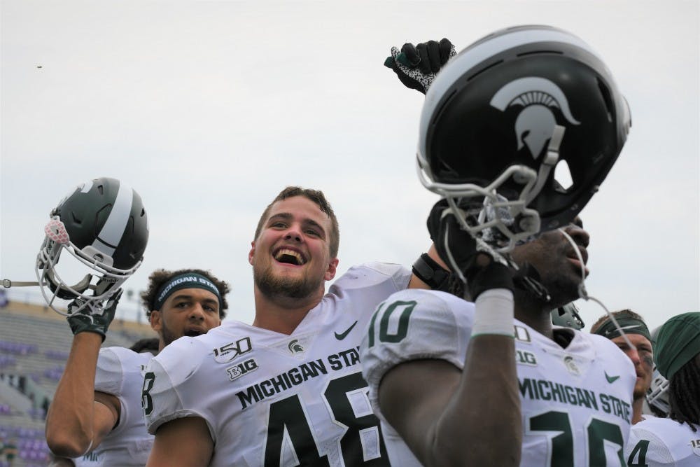 <p>MSU players celebrate following the game against Northwestern on Sept. 21, 2019 at Ryan Field. MSU defeated Northwestern, 31-10.</p>