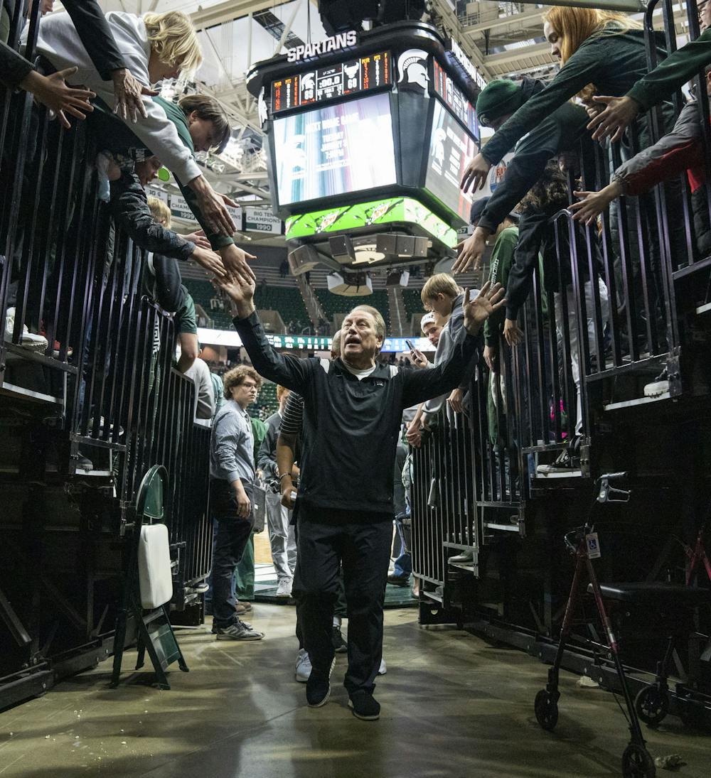 <p>Head coach Tom Izzo high-fives fans after Michigan State’s game against Buffalo on Friday, Dec. 30, 2022, at the Breslin Center. The Spartans ultimately beat the Bulls, 89-68.</p>