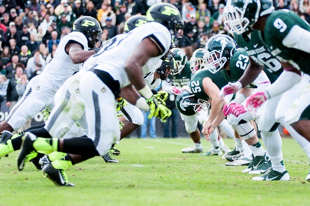 <p>Purdue advances to defend against Michigan State on Saturday during a game against Purdue at Ross-Ade Stadium. The Spartans defeated the Boilermakers,  45-31. Photo courtesy of Purdue Exponent/ Mujtabaa Hasan</p>
