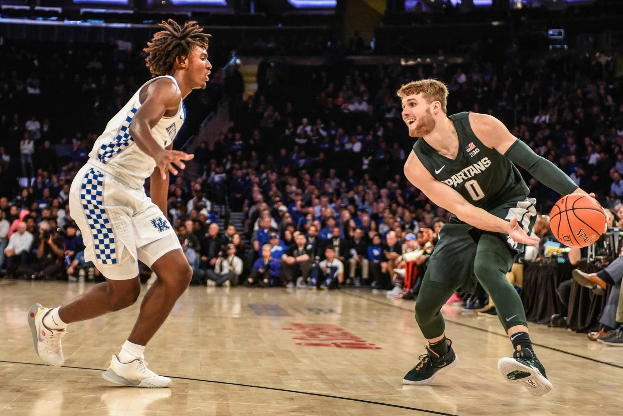 Redshirt-senior forward Kyle Ahrens (0) moves with the ball during the game against Kentucky at the State Farm Champions Classic at Madison Square Garden on Nov. 5, 2019. The Spartans fell to the Wildcats, 69-62.