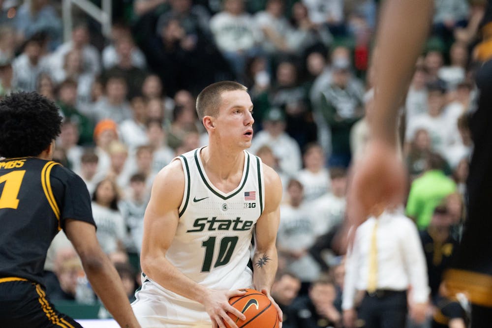 <p>Graduate student Denham Wojcik (10) handles the ball during the matchup against the University of Iowa at the Breslin Center on Dec. 2, 2025.</p>