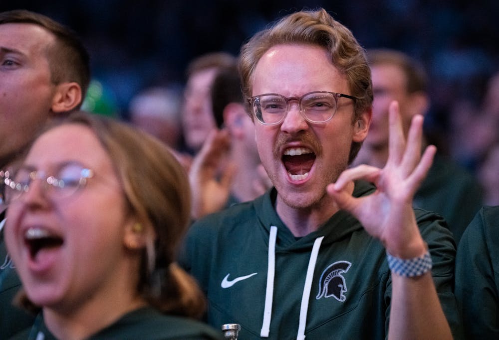 An fan cheers after MSU scores a three pointer during the Sweet Sixteen matchup against Kentucky State University at Madison Square Garden on March 24, 2023. The Spartans fell to the Wildcats in an intense game that ended in overtime. 