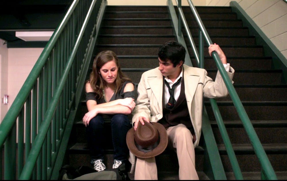 	<p>Student actors Jordan Perry Anderson and Allie Hock film a scene from &#8220;The Case of the Torched Turf,&#8221; a film included in this year&#8217;s East Lansing Film Festival. </p>