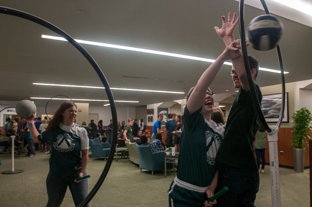 From left: Microbiology junior Courtney Houghtaling, neuroscience sophomore Isabel Truskoski, and electric engineering freshman Quinn Costello play a game of Quidditch on Nov. 18, 2016 at the Union. The University Activities Board hosted "A Night in Diagon Alley" which featured Harry Potter-themed wizardry and witchcraft.