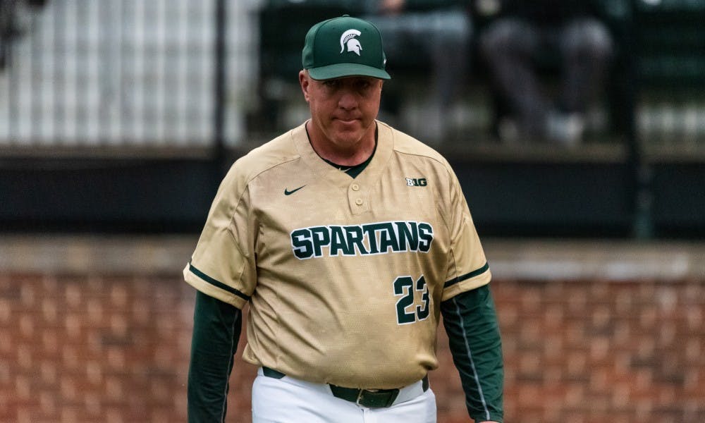 <p>Michigan State coach Jake Boss Jr. (23) returns to the dugout after arguing a call. The Spartans beat the Fighting Illini, 5-2, on May 17, 2019 at McLane Baseball Stadium.</p>