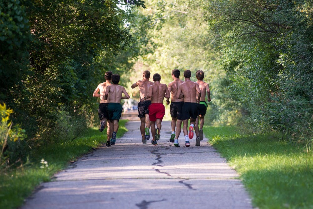 Members of the MSU Running Club run on Aug. 31, 2016 along the Northern Tier Trail in East Lansing. Every week the MSU Running Club has a practice at 5 p.m. Monday through Friday.