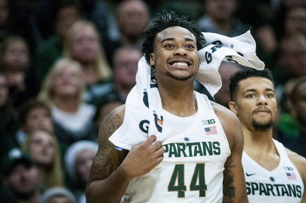 Freshman forward Nick Ward (44) reacts to a play from the bench during the first half of the game against Oakland on Dec. 21, 2016 at Breslin Center. The Spartans defeated the Grizzlies, 77-65. 