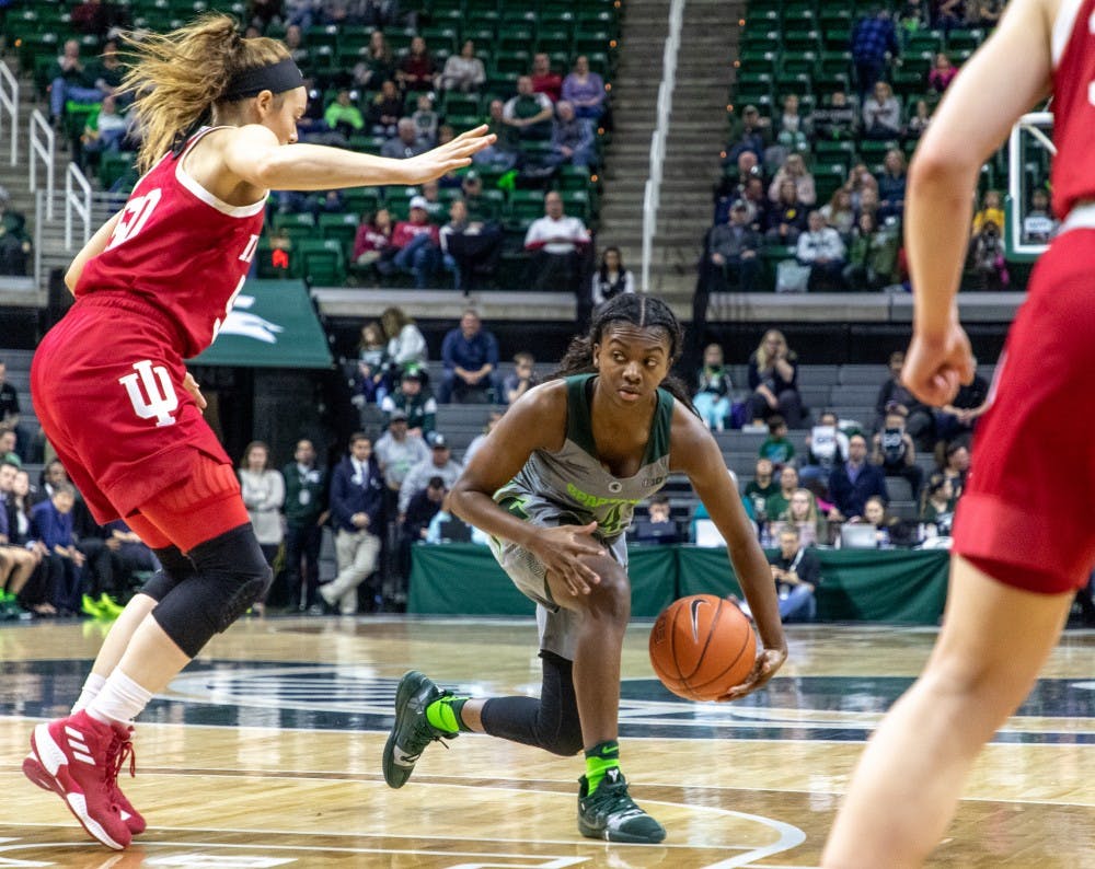 Freshman guard Nia Clouden (24) looks to make a pass during the game against Indiana on Feb.11, 2019. The Spartans lead the Hoosiers 33-30 at halftime.
