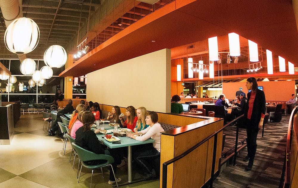 	<p>Students and faculty sit down and enjoy a meal Jan. 6, 2013, at The Vista at Shaw in Shaw Hall. Sunday marked the newly renovated dining hall&#8217;s grand opening as students returned from break. Adam Toolin/The State News</p>