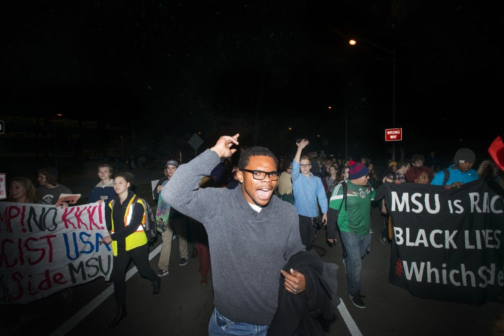 James Madison junior Edward Dance chants during a march on Nov. 10, 2016 at The Rock. The protest was organized by MSU college Democrats against hate, bigotry, racism and sexism.