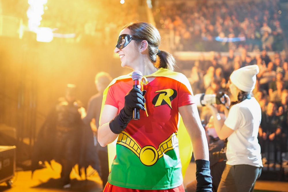 <p>Women's basketball coach Robyn Fralick being introduced during the Michigan State Madness event at the Breslin Center on Oct. 13, 2023. The teams came out in costumes and Fralick was dressed as the hero Robin.</p>