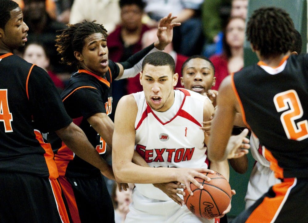Then-Lansing Sexton player Denzel Valentine fights for the ball as he is swarmed by Muskegon Heights players in the MHSAA Class B Final at Breslin Center. 