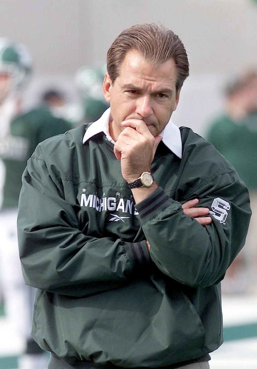 <p>MSU Head Coach Nick Saban passes along the end zone while the Spartans warm up before the game against University of Michigan in Spartan Stadium on Oct. 10, 1999. The Spartans defeated the Wolverines 34-31 and are now 6-0. Jennifer Jankowski/The State News</p>