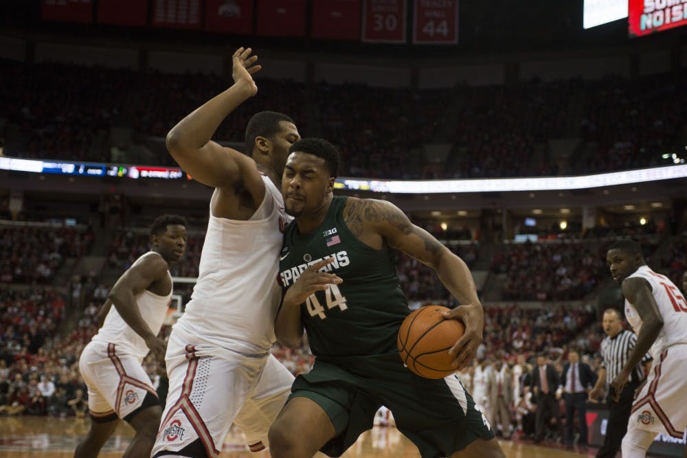 Sophomore guard Nick Ward pushes his way to get to the net during the MSU vs. Ohio State game. The Spartans lost 80-64