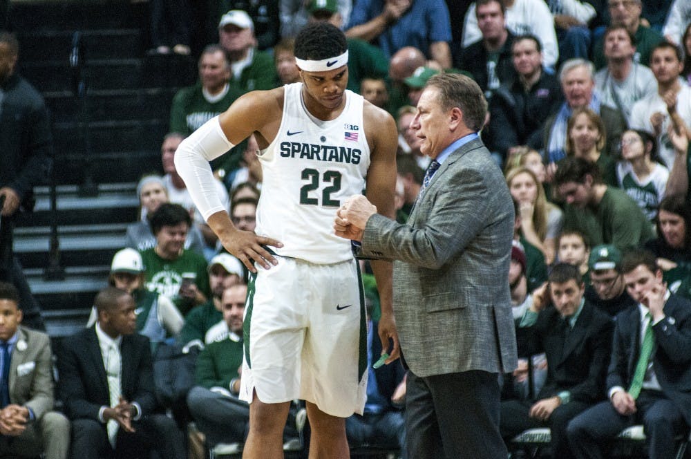 Freshman guard Miles Bridges (22) and head coach Tom Izzo talk with one another during the first half of the men's basketball game against Rutgers on Jan. 4, 2017 at Breslin Center. 