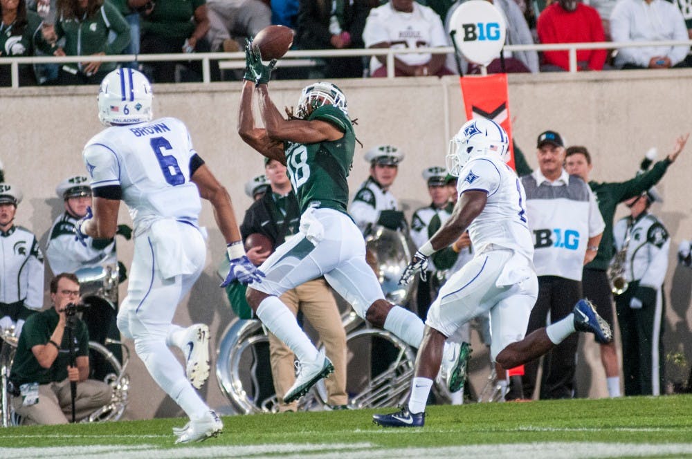 Sophomore wide receiver Felton Davis III (18) catches the football for a touchdown during the home football game against Furman on Sept. 2, 2016 at Spartan Stadium. Felton Davis III had three receptions for a total of 40 yards.