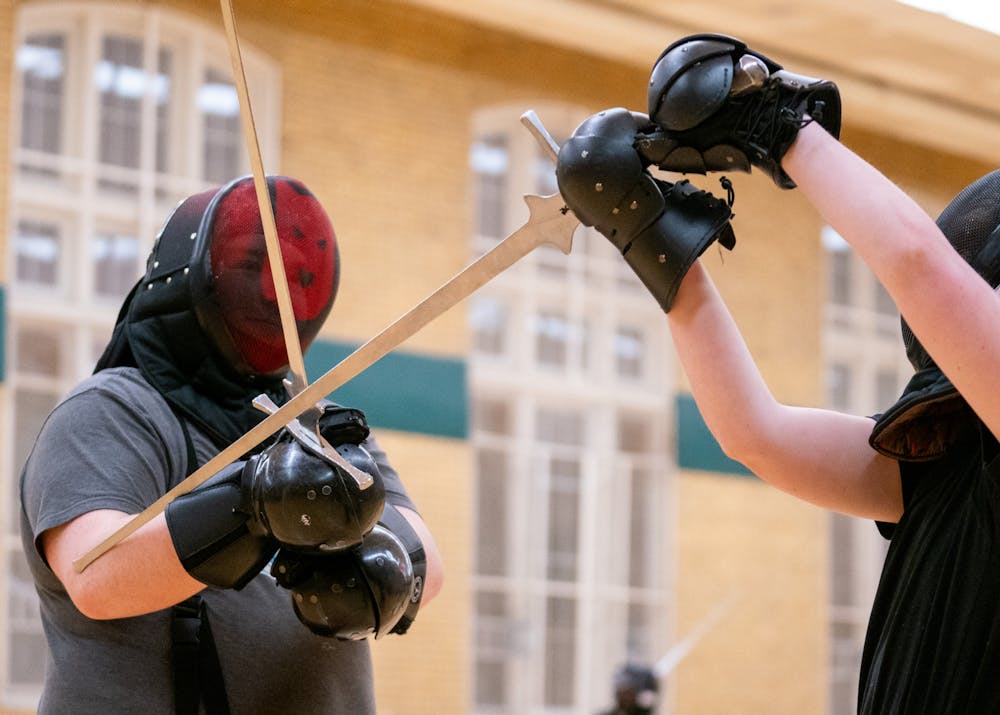 Sophomore Jakob Stibel practicing different techniques and drills during a practice session for the MSU Renaissance Sword Society at IM Circle on March 28, 2024.