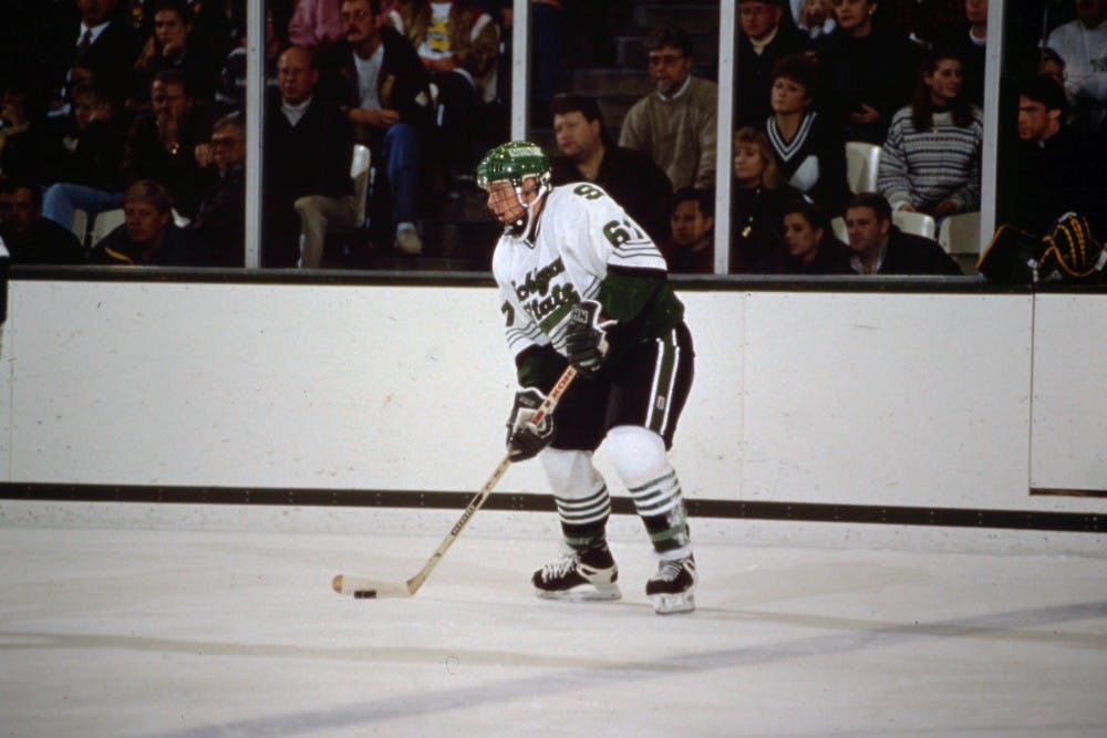 <p>Mike York, a former member of the MSU hockey team who played from 1995-1999, skates down the rink at Munn Ice Arena. &nbsp;Photo Courtesy of MSU Athletic Communications.</p>