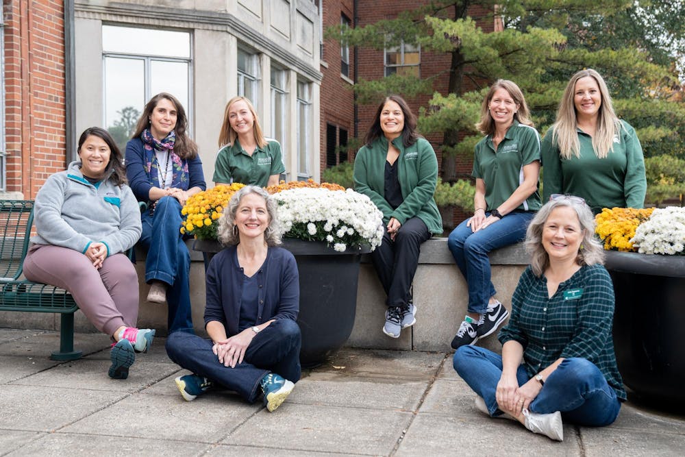 The eating disorder team poses for a photo in front of Olin Health Center on Oct. 27, 2023. 