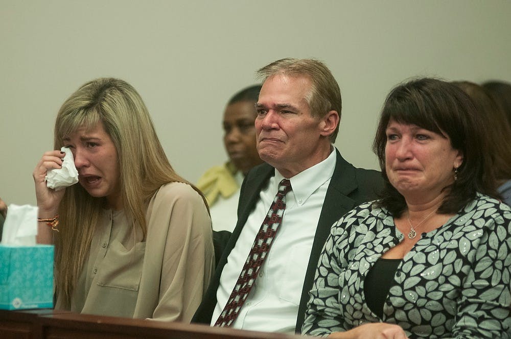 	<p>From left, Shay McCowan, Randy McCowan, and Judy McCowan get emotional during the final statement of Connor McCowan at his sentencing hearing Nov. 6, 2013, at Ingham County Circuit Court in Lansing. McCowan was sentenced to 20-60 years in prison.</p>