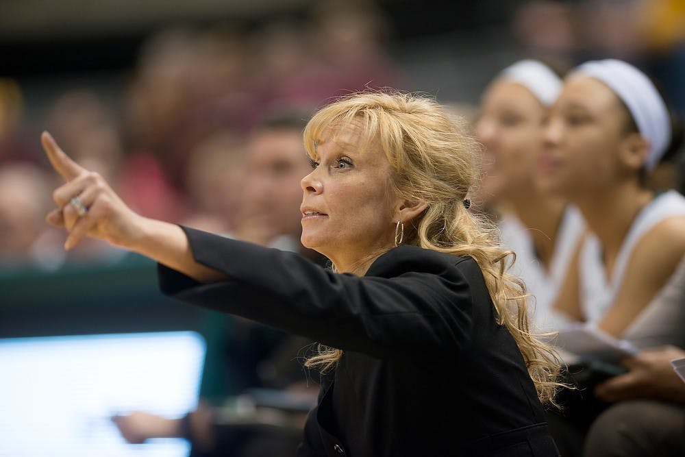 	<p>Head coach Suzy Merchant motions to her team Feb. 24, 2014, during the game against Minnesota at Breslin Center. The Spartans defeated the Gophers, 75-61. Julia Nagy/The State News</p>