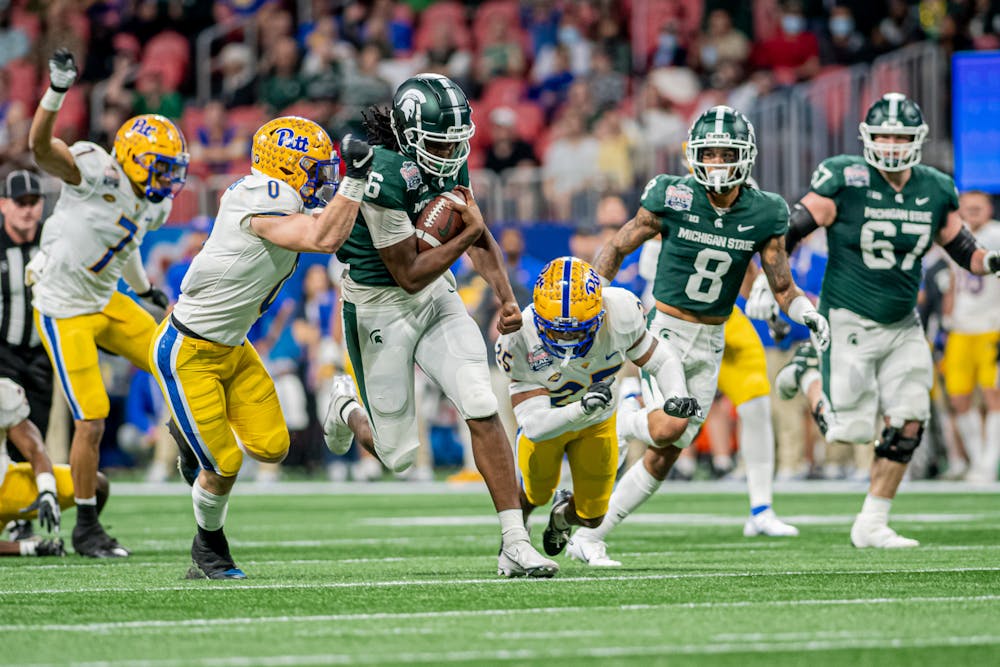 <p>Redshirt freshman tight end Maliq Carr lowers his shoulder through a tackle during the Spartans&#x27; 31-21 victory against Pitt in the Chick-Fil-A Peach Bowl on Dec. 30, 2021. </p>