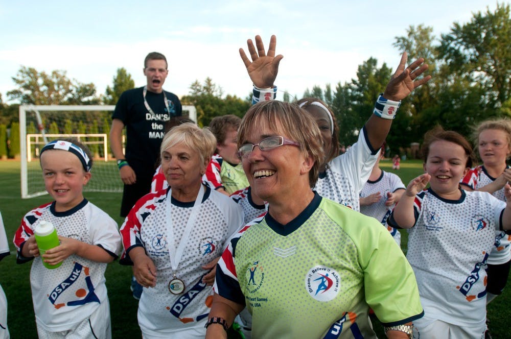 	<p>South Manchester, England resident Penny Dean, center, smiles after beating the <span class="caps">USA</span> August 8, 2013, during the World Dwarf Games at DeMartin Soccer Stadium. Great Britain beat the <span class="caps">USA</span> in a shootout. Weston Brooks/The State News</p>